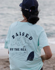 T-Shirt bleu pastel "Raised By The Sea"